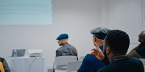 Colleagues at a Black Men Teach conference talk.