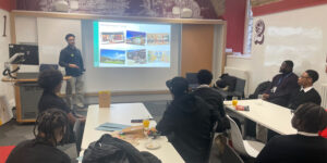 Dreamchasers session with a teacher presenting to a group of students.