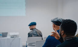 Colleagues at a Black Men Teach conference talk.